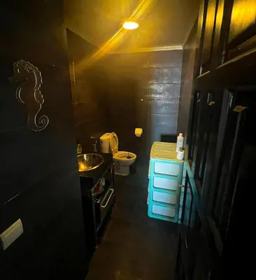 a small bathroom with a sink and a toilet at DarBouazza SurfHouse Sea View in Tamaris