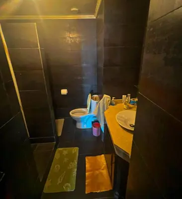 a small bathroom with a toilet and a sink at DarBouazza SurfHouse Sea View in Tamaris