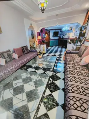 a living room with a couch and a glass floor at Rosy Bliss in Casablanca