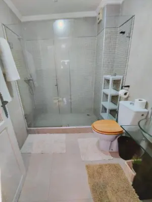 a bathroom with a shower and a toilet and a sink at Rosy Bliss in Casablanca