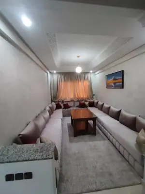 a living room with a couch and a table at Relaxation stay in Casablanca