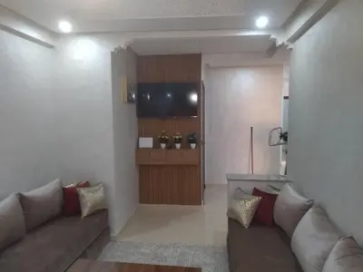 a living room with a couch and a television at Relaxation stay in Casablanca