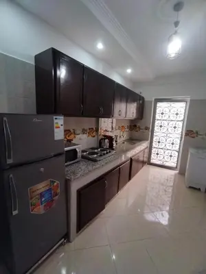 a kitchen with a black refrigerator and a stove at Relaxation stay in Casablanca