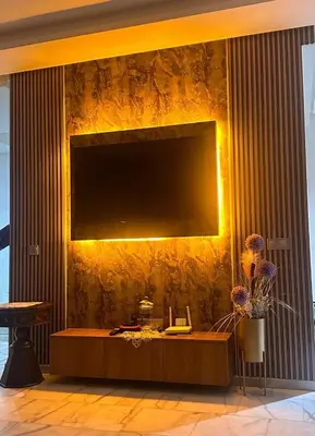 a living room with a large television on a wall at Ocean Park Apartment for rent in Casablanca