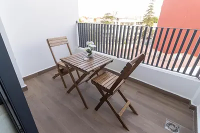 a table and two chairs on a balcony with a table at Small nest in a good location, quiet in Casablanca