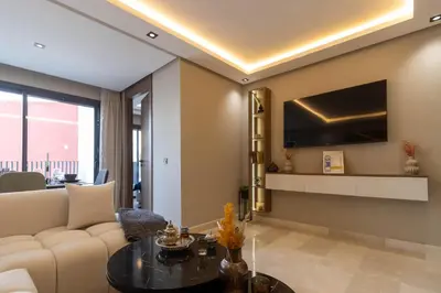 a living room with a couch and a table at Small nest in a good location, quiet in Casablanca
