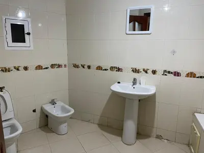 a bathroom with a sink and a toilet at Martil in Anfa-Supérieur