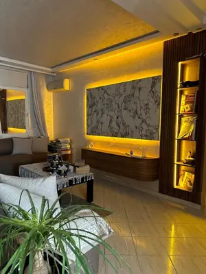 a living room with a couch and a table at Apartment in Casablanca Maarif in Casablanca