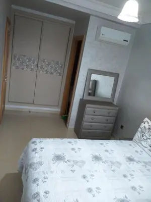 a bedroom with a bed and a dresser and a mirror at Blanca beach in Casablanca