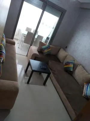 a living room with a couch and a table at Blanca beach in Casablanca