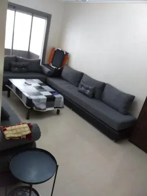 a living room with a couch and a coffee table at Blanca beach in Casablanca