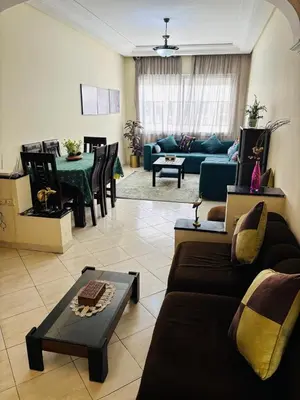 a living room with a couch and a table at Havre de paix au centre de Casablanca in Casablanca