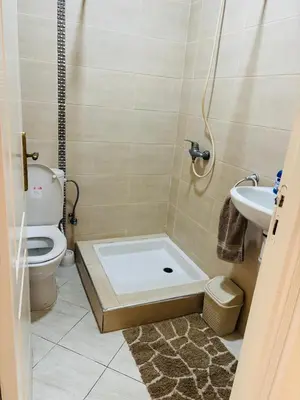 a bathroom with a shower with a toilet and a sink at Havre de paix au centre de Casablanca in Casablanca