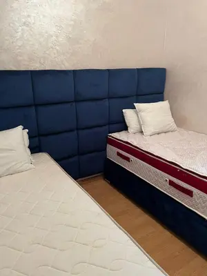 two beds sitting next to each other in a room at Détente et confort en face de mer in Casablanca