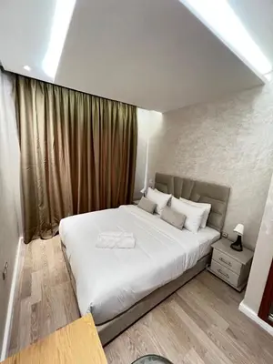 a bedroom with a large white bed in a room at M4 Spacious Appartment in Exclusive Residence by the Sea in Rabat