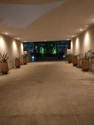 an empty hallway with potted plants and lights at CASABLANCA BORD dE MER A 200 m DE LA PLAGE Appartement Haut de gamme 2 Chambres avec 2 Salles de bain Piscine Salle de Sport plage in Casablanca