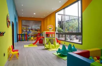 a childrens room with a play area with a playground at Dar Bouazza Plage in Dar Bouazza