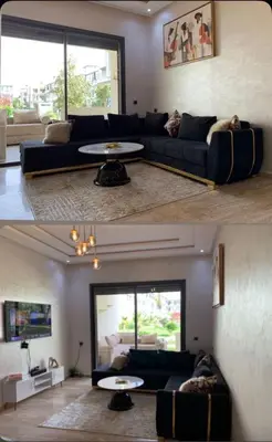 a living room with a couch and a table at Dar Bouazza Plage in Dar Bouazza