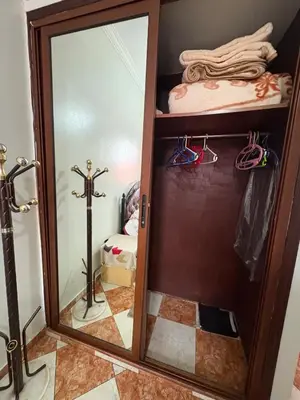 a closet with a mirror and a cross in a room at 2 Bedroom APT Near downtown - Perfect Location in Casablanca