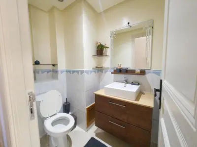a bathroom with a toilet and a sink at MTL 33 Casablanca city center in Casablanca