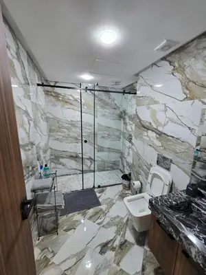 a bathroom with a sink and a toilet at Nouvel Appartement Parc Mohammedia in Mohammedia