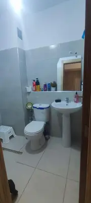 a bathroom with a toilet and a sink at Appartement calme absolu in Casablanca