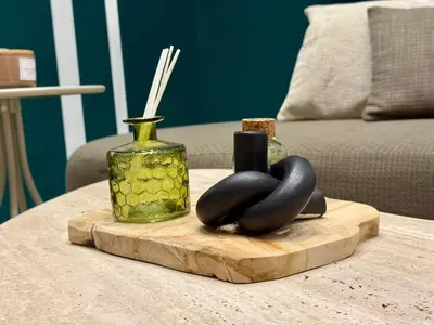 a table with a wooden cutting board and a vase at Duplex franceville in Casablanca