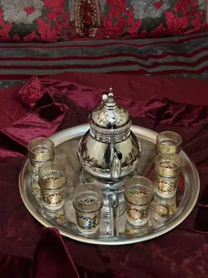 a silver tray with a tea pot and some cups at Calme, plage 8 min, tout proche in Temara