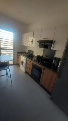 a kitchen with a stove and a dishwasher at Sublime appartement à MANSOURIA in Mansouria