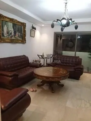 a living room with a couch and a table at Zineb in Nouaseur
