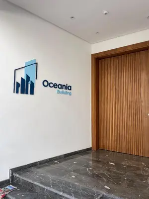an office with a door and a sign on the wall at Appartement chic Rabat in Rabat