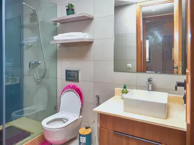a bathroom with a toilet and a sink and a shower at Appartement haut standing in Casablanca