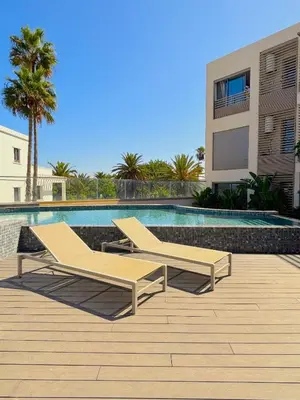 two lounge chairs sitting next to a swimming pool at Casa Tina in Casablanca