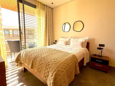 a bedroom with a bed with two mirrors on the wall at Casa Tina in Casablanca