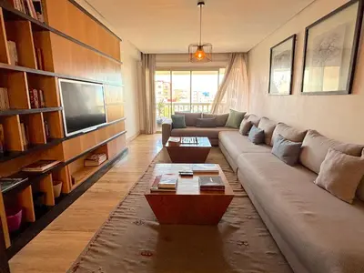 a living room with a couch and a tv at Casa Sahifa in Casablanca