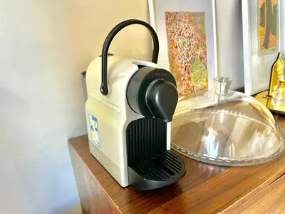 a toaster sitting on top of a wooden table at Casabay Kettani Sidi Rahal in Sidi Rahal