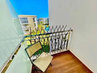 a pair of chairs sitting on a balcony at Casabay Kettani Sidi Rahal in Sidi Rahal
