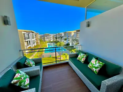 a balcony with couches and a view of a city at Casabay Kettani Sidi Rahal in Sidi Rahal