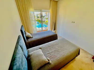 a living room with a couch and a window at Casabay Kettani Sidi Rahal in Sidi Rahal