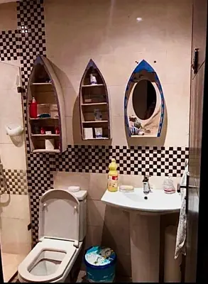 a bathroom with a toilet and a sink and mirror at Appart avec piscine in Mohammedia