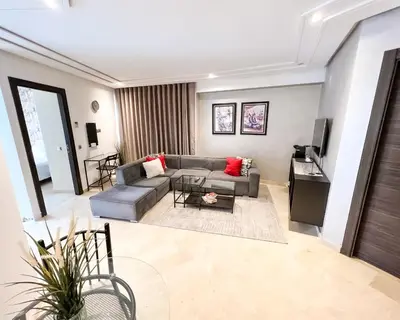 a living room with a couch and a tv at Stylish 1BR in Racine - Prime Racine Location in Casablanca