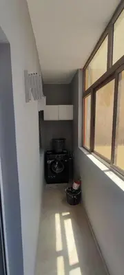 a small kitchen with a stove and a window at Confort & Style à Mohammedia parc in Mohammedia