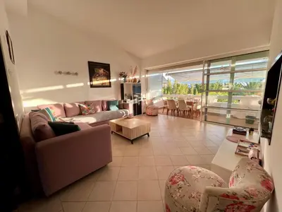 a living room with a couch and chairs and a table at Appartement Bouznika Bay Golf Beach in Bouznika