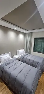 a bedroom with two beds and a window at Casablanca in Casablanca