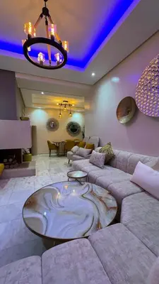 a living room with a large couch and a table at Casablanca in Casablanca