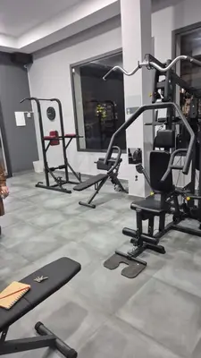 a gym with several exercise equipment in a room at Morostay in Casablanca