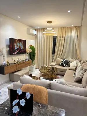 a living room with two couches and a table at Morostay in Casablanca