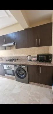 a kitchen with a stove and a counter top at 2Roms 5mn Palmier Maarif Distriktet Wifi Rapide A4 in Casablanca
