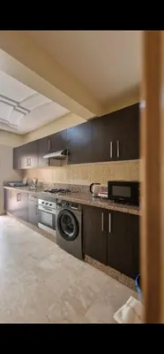 a large kitchen with a stove and a dishwasher at 2Roms 5mn Palmier Maarif Distriktet Wifi Rapide A4 in Casablanca
