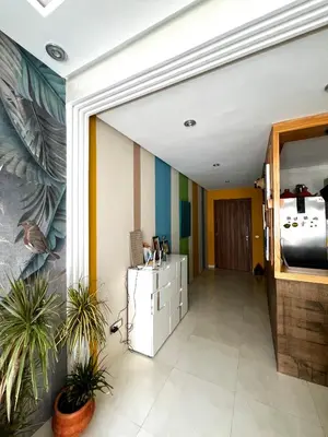 an office with a hallway with plants in it at Appartement Chaleureux in Bouznika